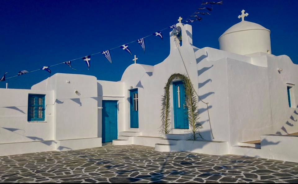 Whitewashed building with blue accents
